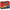red product box for stomp racers featuring two children jumping on air-powered race cars
