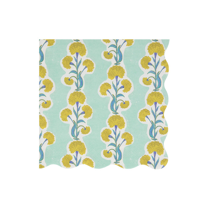 A blue lunch napkin with scalloped edges and a yellow floral pattern
